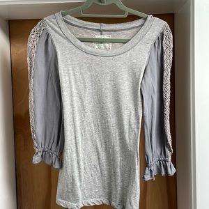 Bohemian t-shirt with lace sleeves and back rouche detail.